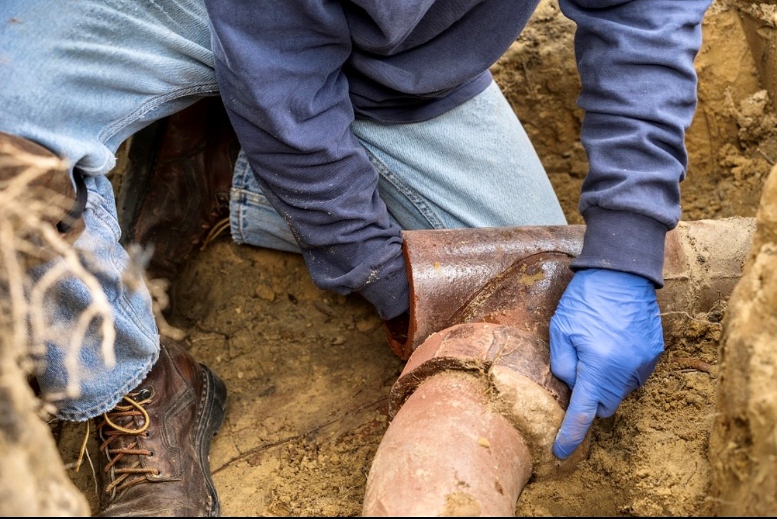 Danny repairing a broken water pipe during an emergency plumbing service in Hesperia, CA.